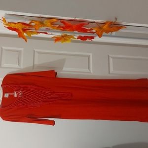 A brand new red dress from ZARA sizing is large.